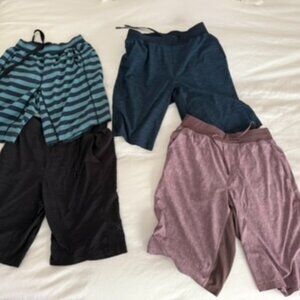FOUR PAIRS OF VINTAGE LIMITED EDITION LULULEMON PACEBREAKER 9" ATHLETIC SHORTS